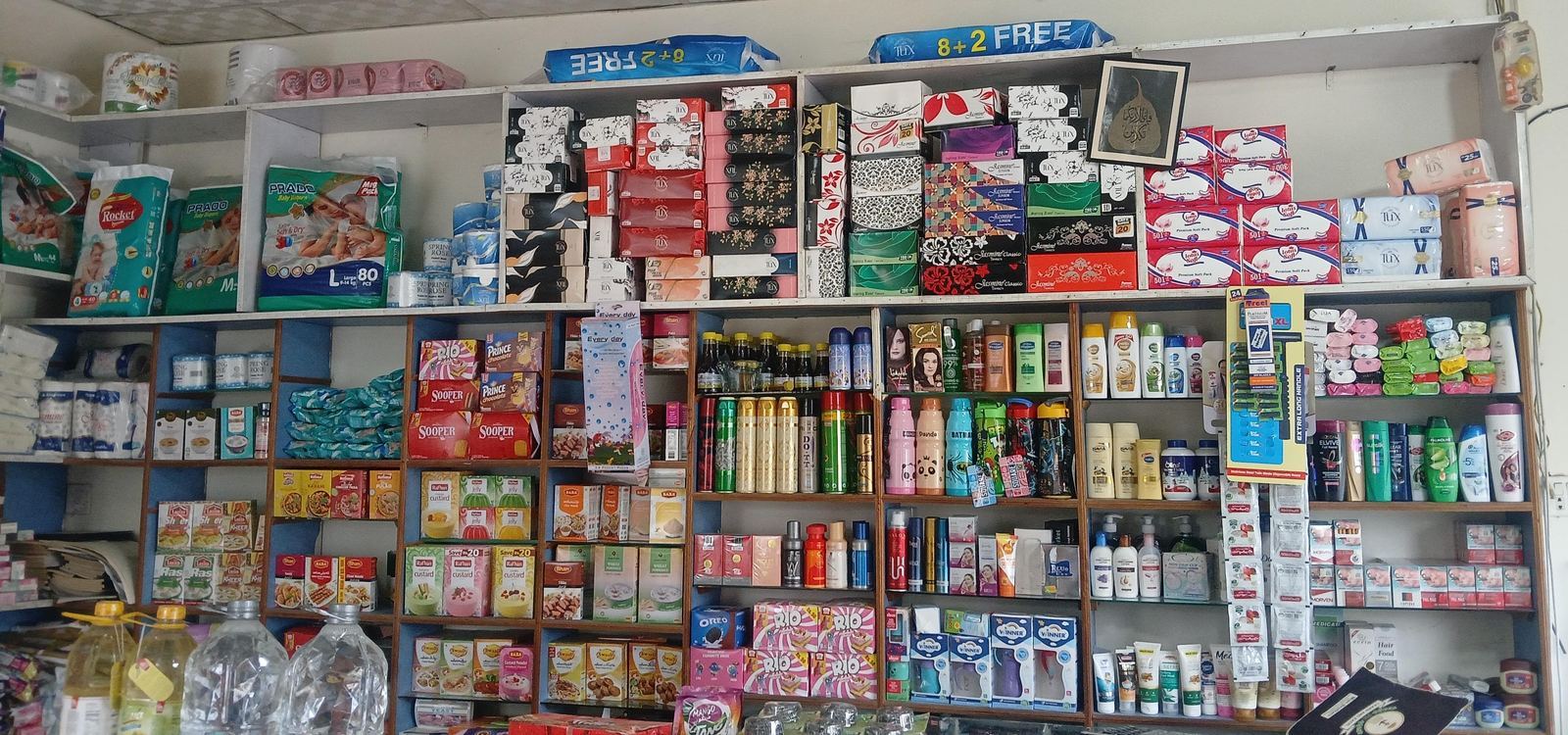 Store shelf with baby diapers, tissues and daily essentials